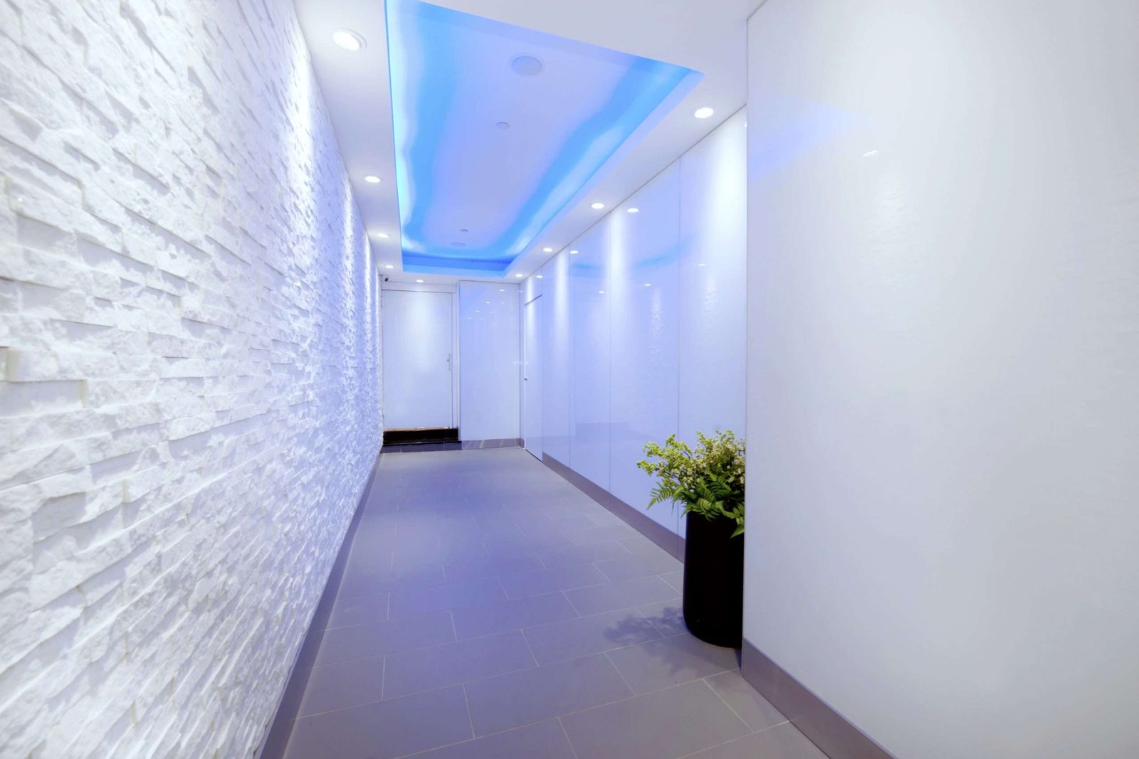 The venue's modern white lobby corridor