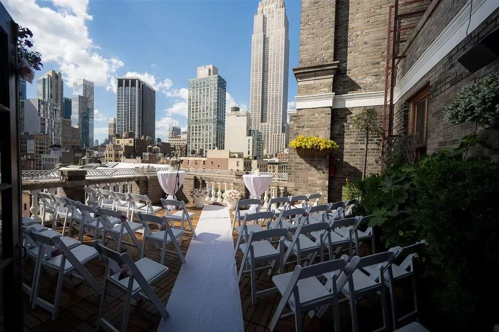 A wedding ceremony set on the Terrace with the skyline behind