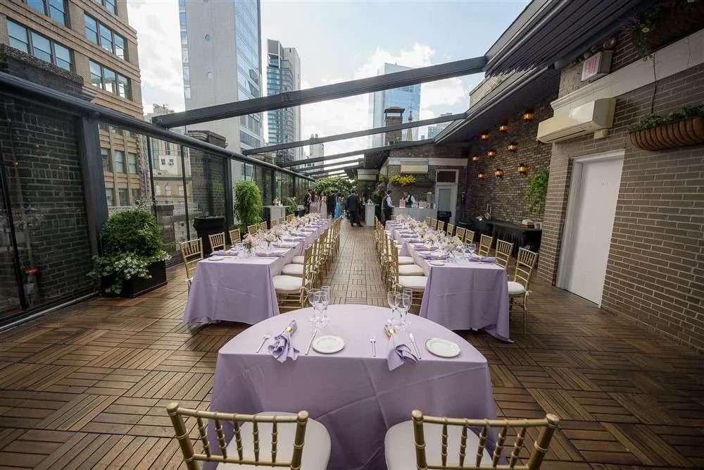 Round tables set for dinner on the Terrace